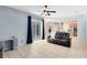 Bright living room showcasing tile floors and sliding glass doors to the backyard at 640 Brookfield Pl, Apopka, FL 32712