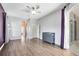 Large main bedroom with laminate flooring, a ceiling fan, and sliding glass door access to pool at 640 Brookfield Pl, Apopka, FL 32712