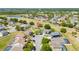 Aerial view of the home situated on a well-manicured lot in a golf course community at 654 Chadbury Way, Kissimmee, FL 34744