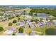 Stunning aerial view of a golf course community with homes, lakes and manicured greens at 654 Chadbury Way, Kissimmee, FL 34744