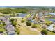 Wide aerial view shows community near lakes and golf course, highlighting an active lifestyle near the water at 654 Chadbury Way, Kissimmee, FL 34744