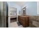 Bathroom showing tiled shower and sink with granite countertops, conveniently located off of bedroom at 654 Chadbury Way, Kissimmee, FL 34744