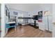Bright bedroom featuring a bunk bed, a study desk, and wood-look flooring at 654 Chadbury Way, Kissimmee, FL 34744