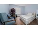Comfortable bedroom with soft blue walls and light hardwood flooring at 654 Chadbury Way, Kissimmee, FL 34744