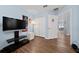 Bright bedroom featuring light blue walls and wood-look flooring at 654 Chadbury Way, Kissimmee, FL 34744
