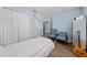Cozy bedroom featuring a guitar, hardwood floors, and a neutral color scheme at 654 Chadbury Way, Kissimmee, FL 34744