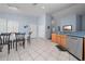 Spacious open floor plan with a combined kitchen and dining area at 654 Chadbury Way, Kissimmee, FL 34744