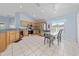 Spacious kitchen with stainless steel appliances, light cabinets, and a breakfast nook at 654 Chadbury Way, Kissimmee, FL 34744