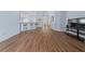 Spacious living room with a wood-look floor and bright light at 654 Chadbury Way, Kissimmee, FL 34744