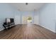 Open living room featuring wood-look floors and sliding glass doors to the pool at 654 Chadbury Way, Kissimmee, FL 34744