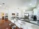 Bright kitchen with breakfast bar, stainless steel appliances, and an open layout for entertaining at 6559 Grosvenor Ln, Orlando, FL 32835