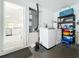 Laundry room with white washer and dryer units, utilities, and storage at 6559 Grosvenor Ln, Orlando, FL 32835