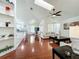 Bright and open floor plan with vaulted ceilings, hardwood floors, and seamless living spaces at 6559 Grosvenor Ln, Orlando, FL 32835