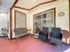 Cozy covered patio with outdoor seating, perfect for relaxing and entertaining guests at 6559 Grosvenor Ln, Orlando, FL 32835