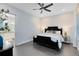 Comfortable bedroom with dark furniture, soft lighting, and an en-suite bathroom at 6665 Bridgman St, Orlando, FL 32827