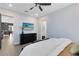 Serene bedroom with a dark dresser, tiled floors, and an inviting ambiance at 6665 Bridgman St, Orlando, FL 32827
