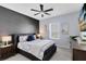 Charming bedroom features a ceiling fan, a large picture window, and neutral decor at 6665 Bridgman St, Orlando, FL 32827
