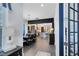 Inviting dining area flowing into a modern kitchen, featuring an elegant chandelier and neutral decor at 6665 Bridgman St, Orlando, FL 32827