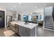 Modern kitchen with a large island, stainless steel appliances, and open layout to the living area at 6665 Bridgman St, Orlando, FL 32827