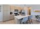 Modern kitchen features stainless steel appliances, an island with a sink, and breakfast bar seating at 6665 Bridgman St, Orlando, FL 32827