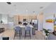 Bright kitchen features a central island with bar stool seating, stainless steel appliances, and lots of room to prep meals at 6665 Bridgman St, Orlando, FL 32827