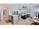 This living room features a modern kitchen, a large window, and recessed lighting at 6665 Bridgman St, Orlando, FL 32827