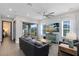 Cozy living room with a large sliding glass door, modern decor, and comfortable seating arrangement at 6665 Bridgman St, Orlando, FL 32827