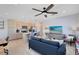 This living room features a modern kitchen, a large window, and comfortable seating at 6665 Bridgman St, Orlando, FL 32827