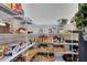 Well-organized walk-in pantry with ample shelving, storage baskets, and efficient space utilization at 6665 Bridgman St, Orlando, FL 32827