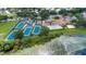Aerial view of community amenities including tennis courts, basketball court, pool, and clubhouse at 7455 Sparkling Lake Rd, Orlando, FL 32819