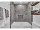 Modern bathroom featuring a glass shower door and decorative mosaic tile detail at 7455 Sparkling Lake Rd, Orlando, FL 32819