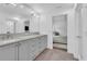Bright bathroom with double vanity, large mirror, and sleek fixtures at 7455 Sparkling Lake Rd, Orlando, FL 32819