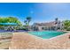 Community pool with lounge chairs, shade structures, and nearby playground for Gathering fun at 7455 Sparkling Lake Rd, Orlando, FL 32819