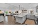 Bright, open kitchen with a large island, seamless flow to the living area, and modern finishes at 7455 Sparkling Lake Rd, Orlando, FL 32819