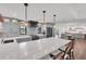 Open-concept kitchen boasts a large island, stainless steel appliances, and ample counter space at 7455 Sparkling Lake Rd, Orlando, FL 32819