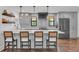 Modern kitchen featuring gray cabinetry, stylish bar stools, and ample counter space, perfect for cooking at 7455 Sparkling Lake Rd, Orlando, FL 32819