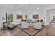 Bright living room featuring modern furnishings, hardwood floors, and stylish decor for a comfortable living space at 7455 Sparkling Lake Rd, Orlando, FL 32819