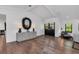 Elegant living room with hardwood floors, stylish decor, and ample space for comfortable seating and entertaining at 7455 Sparkling Lake Rd, Orlando, FL 32819