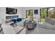 Inviting living room with fireplace, patio access, and comfortable seating for a relaxing atmosphere at 7455 Sparkling Lake Rd, Orlando, FL 32819