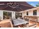 Outdoor patio space with dining, bar, and lounge areas at 7455 Sparkling Lake Rd, Orlando, FL 32819