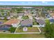 Aerial view of the home, backyard, patio, playground, and neighborhood at 820 Timber Isle Dr, Orlando, FL 32828