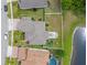 Birds eye view of the home, paver patio, playground, and surrounding landscaping at 820 Timber Isle Dr, Orlando, FL 32828