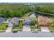Aerial view highlighting property lines, backyard with pond, and neighborhood at 820 Timber Isle Dr, Orlando, FL 32828