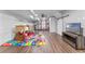 Finished basement with play area, gym, and modern sliding barn door at 820 Timber Isle Dr, Orlando, FL 32828