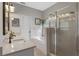 Bathroom features a dual sink vanity, a soaking tub, and a glass-enclosed shower at 820 Timber Isle Dr, Orlando, FL 32828