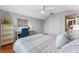 Comfortable bedroom with white ceiling fan and a desk at 820 Timber Isle Dr, Orlando, FL 32828