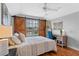 Bedroom features a sliding barn door, desk, and stylish decorations at 820 Timber Isle Dr, Orlando, FL 32828