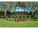 Timber Isle community entrance sign with manicured bushes and greenery at 820 Timber Isle Dr, Orlando, FL 32828