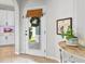 Inviting entryway featuring a glass door, tile floors, and a decorative table at 820 Timber Isle Dr, Orlando, FL 32828