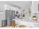 Open-concept kitchen with stainless steel appliances, breakfast bar, and quartz countertops at 820 Timber Isle Dr, Orlando, FL 32828
